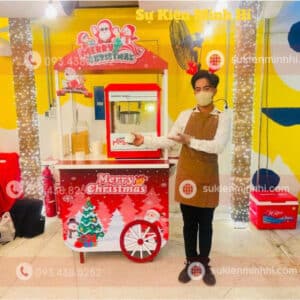 Dịch Vụ Làm Bắp Rang Bơ Chuyên Nghiệp Cho Sự Kiện Tại TPHCM Nhân sự làm bắp rang bơ cho sự kiện giáng sinh 2025 do Sự Kiện Minh Hi cung cấp