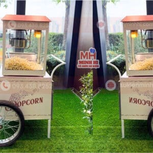 Dịch Vụ Làm Bắp Rang Bơ Chuyên Nghiệp Cho Sự Kiện Tại TPHCM Máy làm bắp rang bơ với thiết kế dạng mô hình xe theo yêu cầu của sự kiện